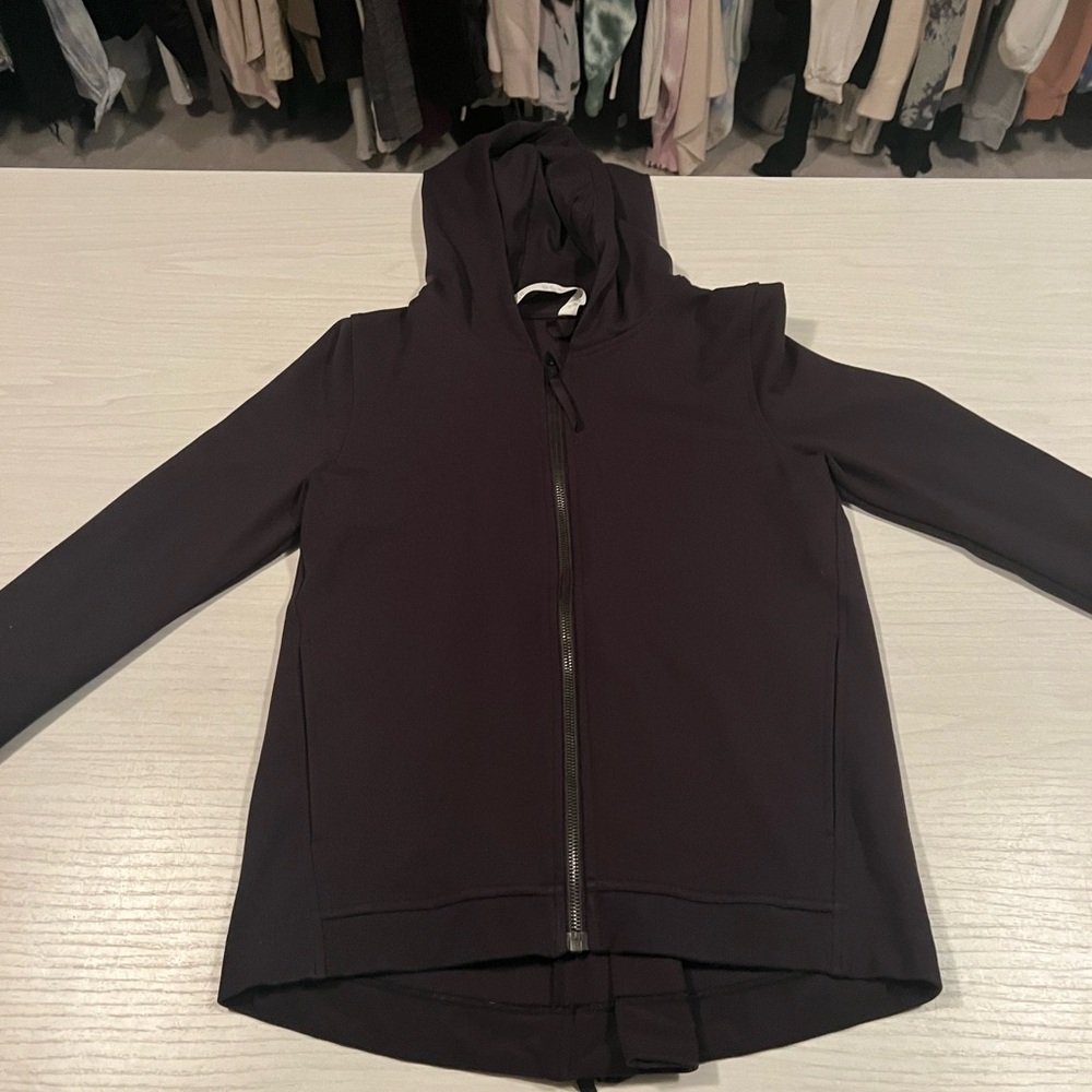 Black long LULULEMON zip up. Zipper up the front and back. Great condition!